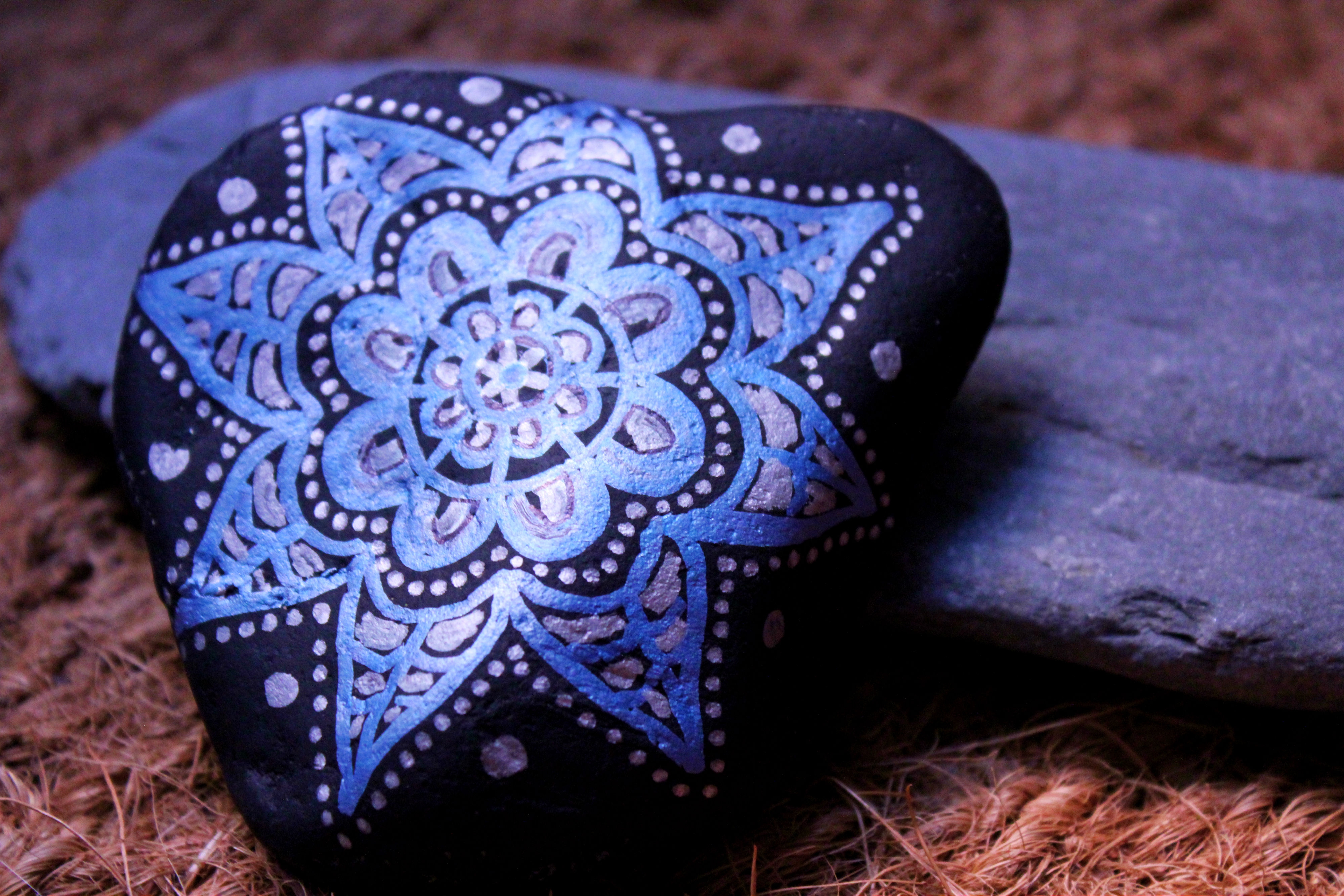 Montseny stone painted in metallic blue on black