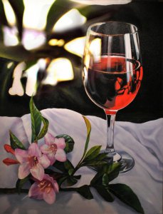 Glass of red wine and flowers