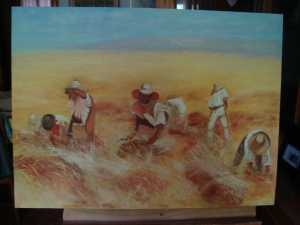 hombres cosechando en un campo de trigo