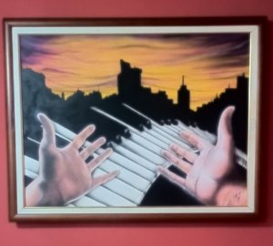 My hands on the piano pointing the way