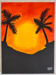Sunset between palm trees