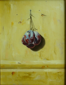 PLUMS HANGING ON OCHER BACKGROUND