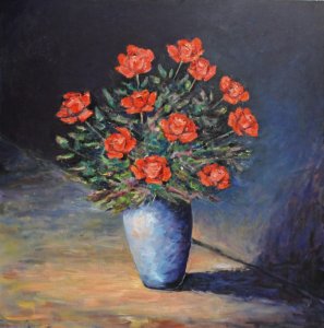 Florero con rosas rojas